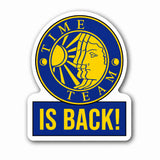 A die-cut sticker or decal with a blue and yellow circular emblem reading 'TIME TEAM' and a yellow sun-and-head illustration, plus a blue lower section with the text 'IS BACK!' in yellow on a white background.
